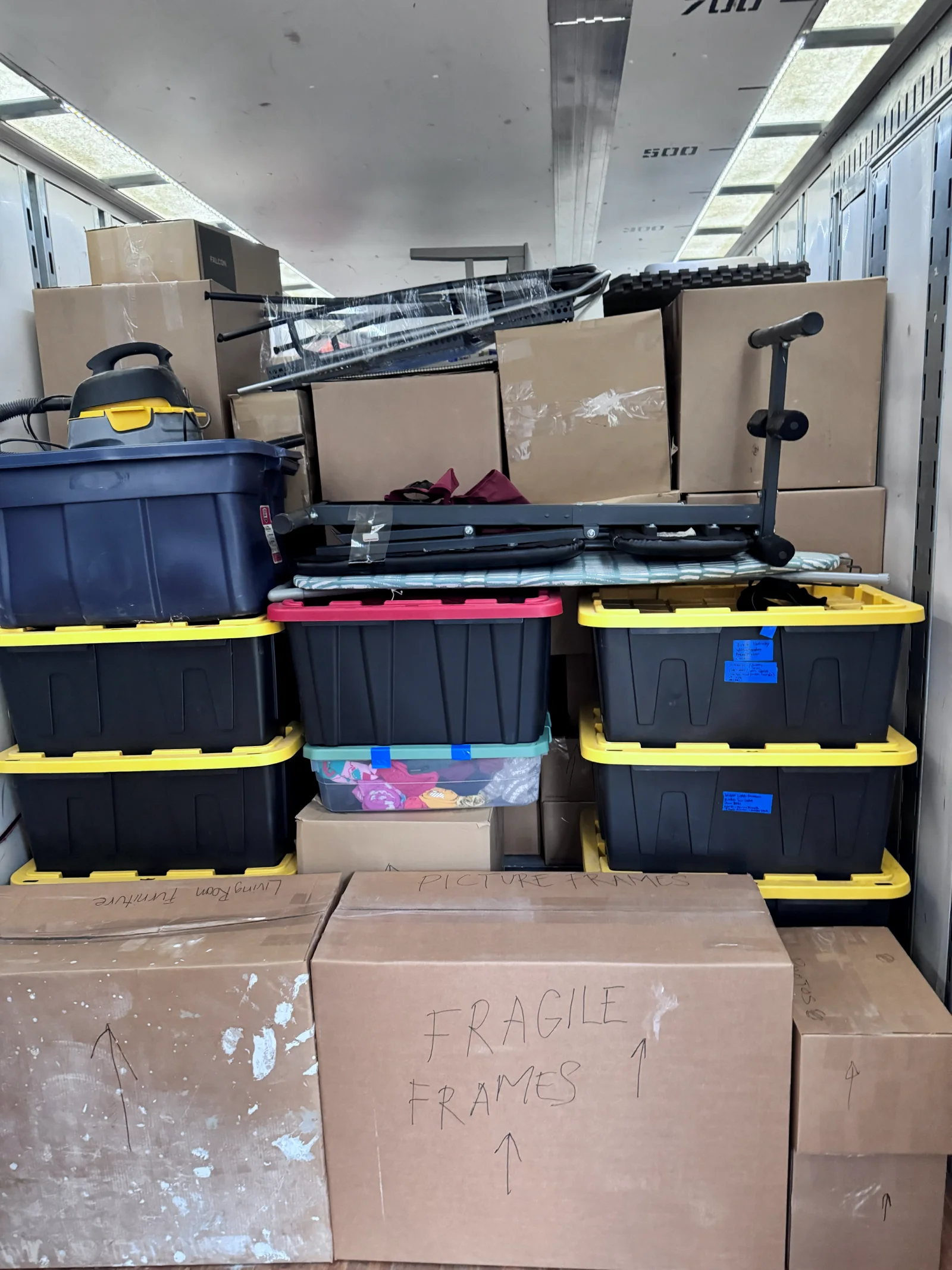 Professionally packed moving truck interior with labeled boxes and totes, Needham MA movers